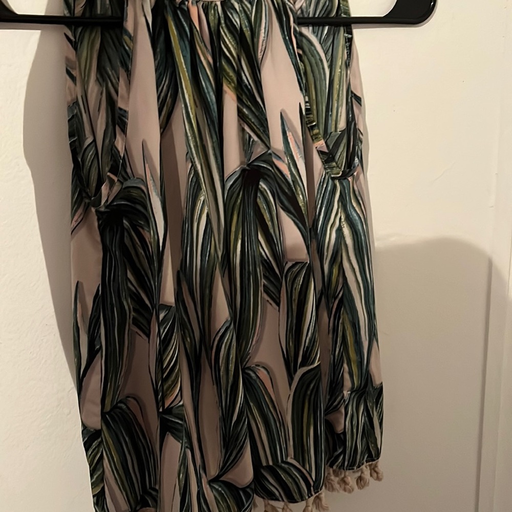 Beautiful summer blouse. Green leafs with an tie in the back